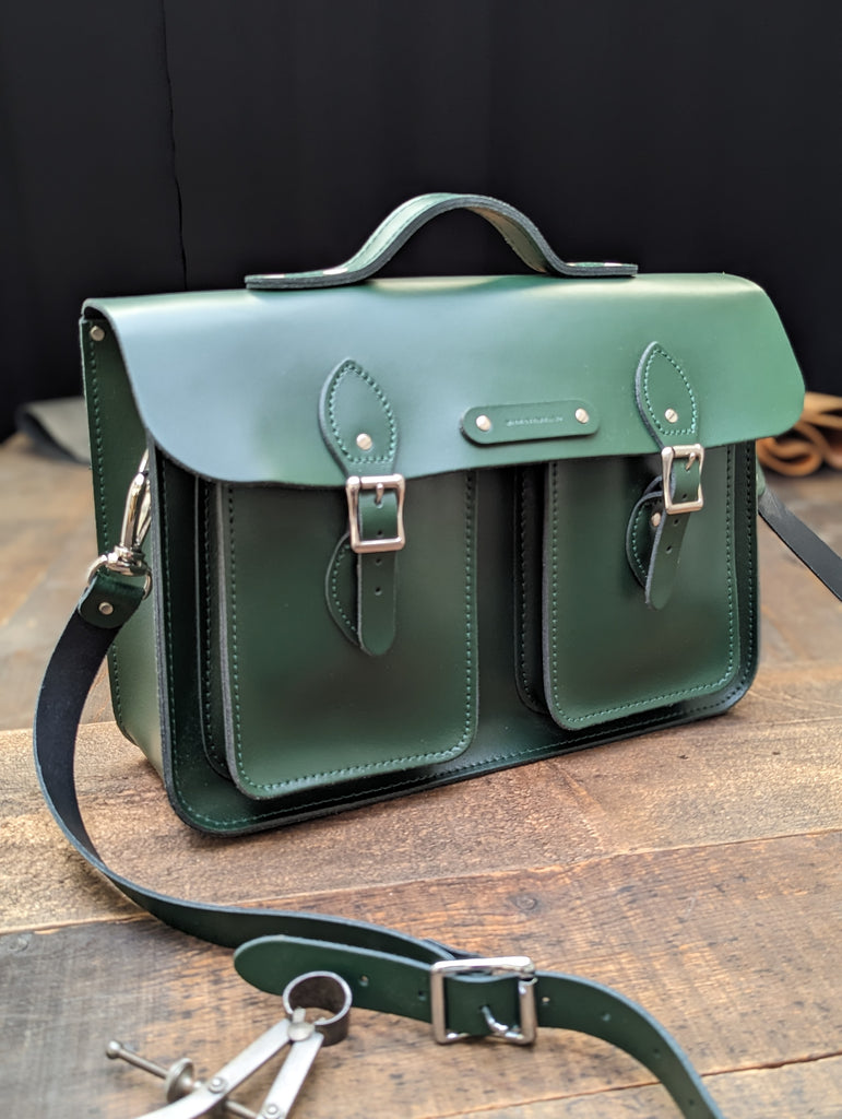15" Clasic Satchel with Twin Front Pockets, a Bolt-on handle and a "Made in England" name plate, and a Key Loop made from Racing Green Leather (MMRP USD$385)