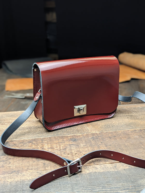 Medium Pixie with Inner and Outer Slip Pockets made from Patent Oxblood Leather (MMRP USD$215)