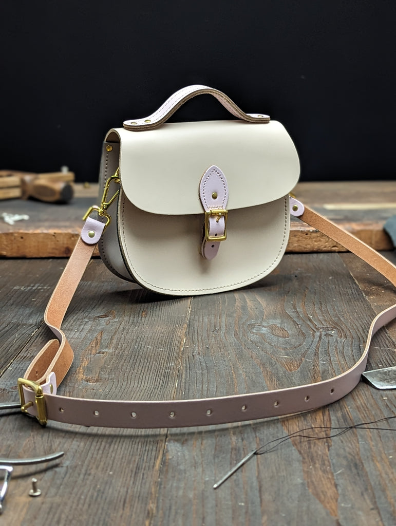 Medium Sporran with a Hidden Magnetic Fastener, Bolt-on Handle, Outer Slip Pocket and Gold Hardware made from Sherbet Lemon and Parma Violet Leathers (MMRP USD$255)