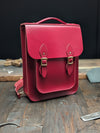 Medium Portrait Backpack with Magnetic Fasteners and Gold Hardware in Pillarbox Red (MMRP USD$340)