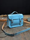Festival Satchel with a 20mm Volume Boost, a Bolt-on Handle, No Address Card Window and an Outer Slip Pocket made from Baby Blue Leather (MMRP USD$185)