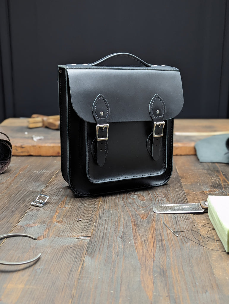 Small Portrait Backpack with a 25mm Volume Boost made from Charcoal Black Leather (MMRP USD$285)