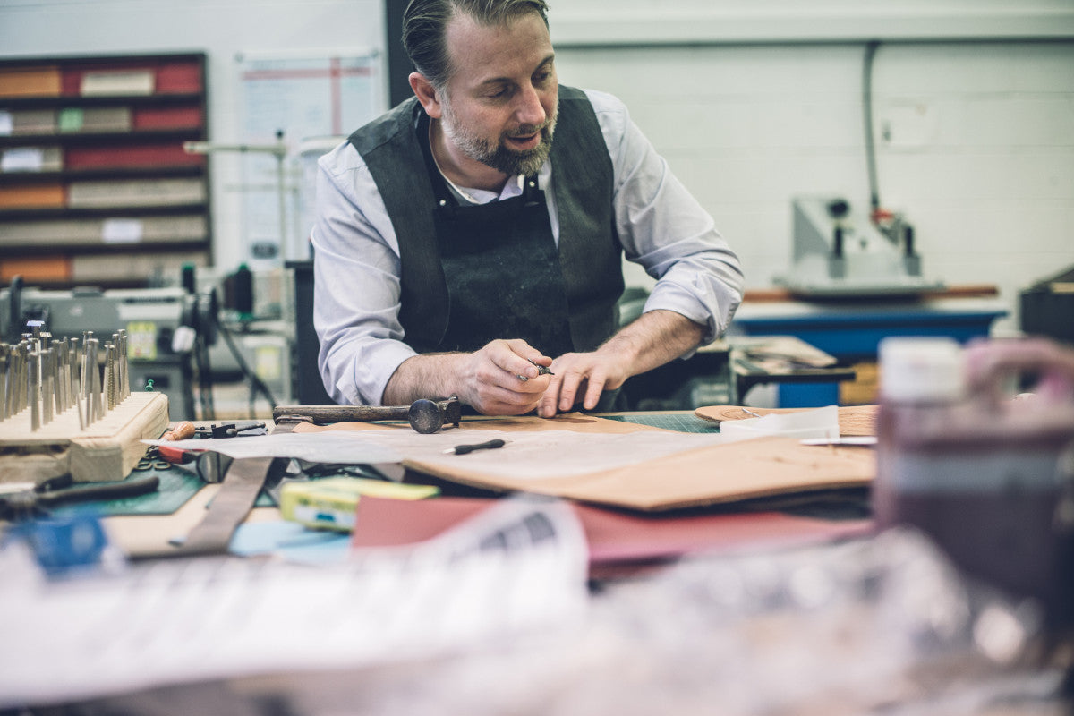 Master Craftsman Repairing Leathergoods
